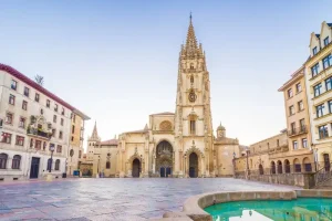 Plaza Alfonso with Oviedo cathedral at the back of the square and part of a fountain at the front.