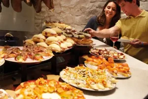 Pintxos in a bar plates on the bar full of different ones
