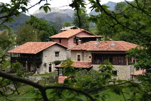 The hotel  with its red tile roofs consists of three separate buildings with stone walls with a large garden all around.