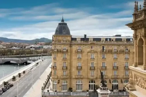 Maria Cristina Hotel San Sebastian - the side of the building and the river and a bridge